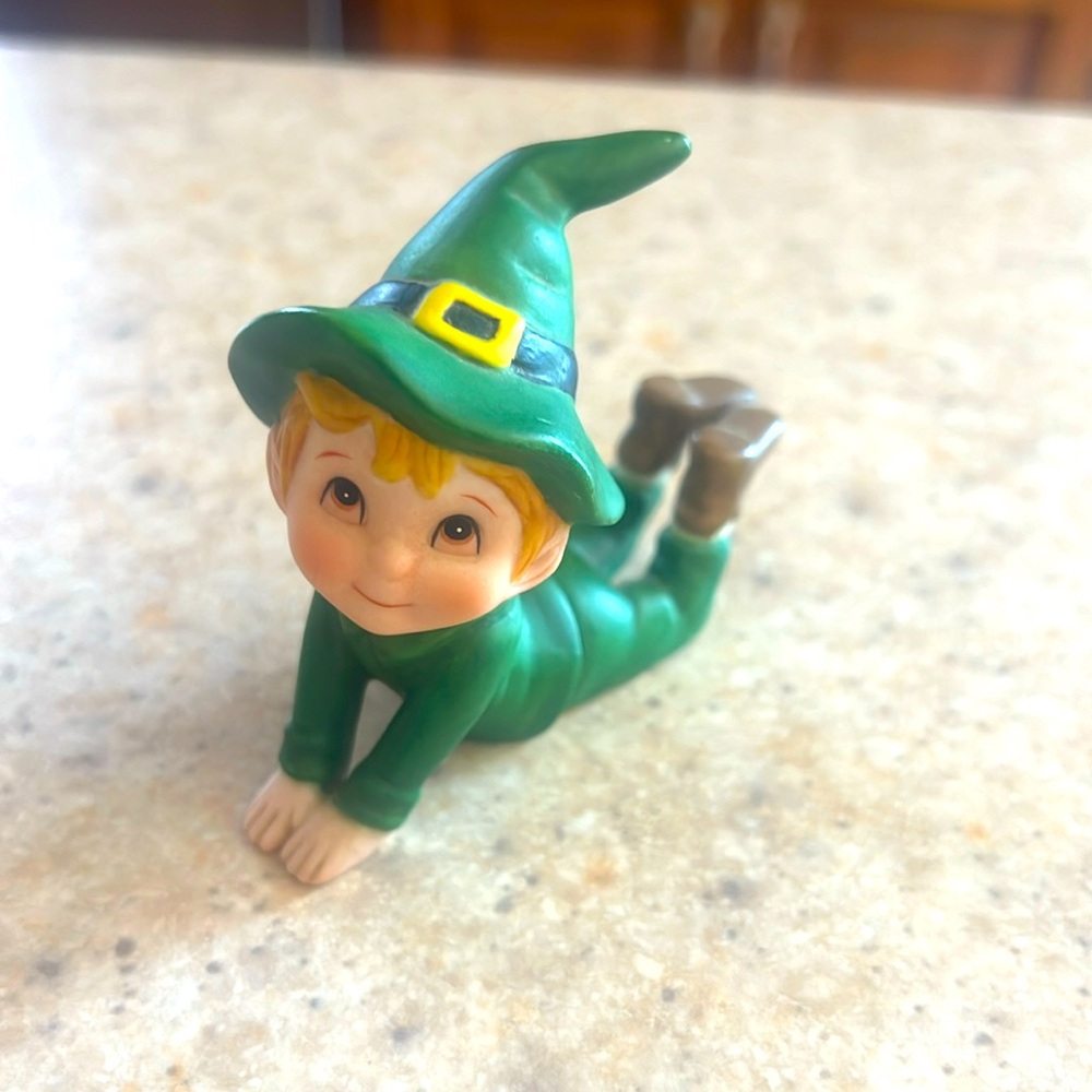 Lefton little boy leprechaun elf in a green outfit and hat.